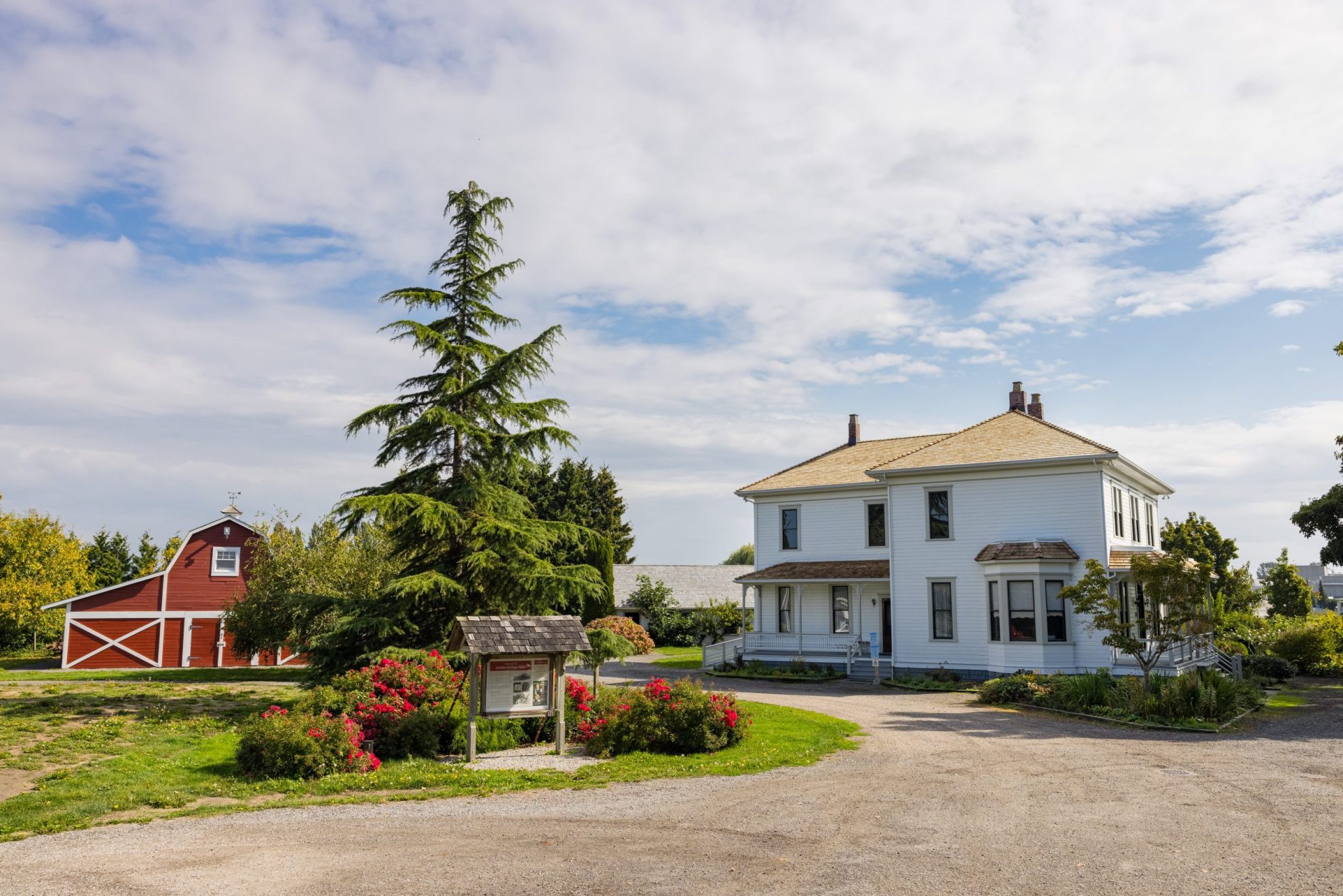 Wide view of the London Farm farmhouse and barn